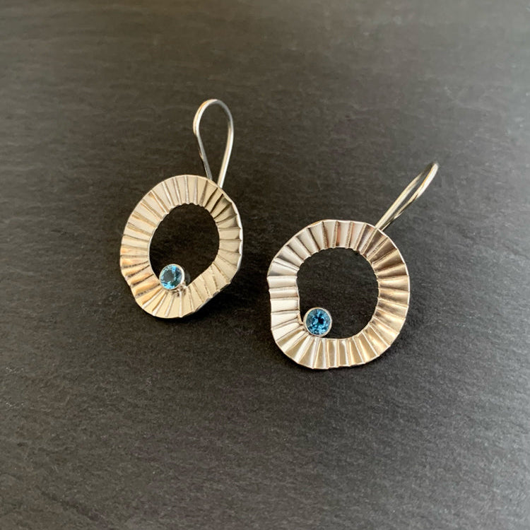 sterling silver circular earrings with blue stone