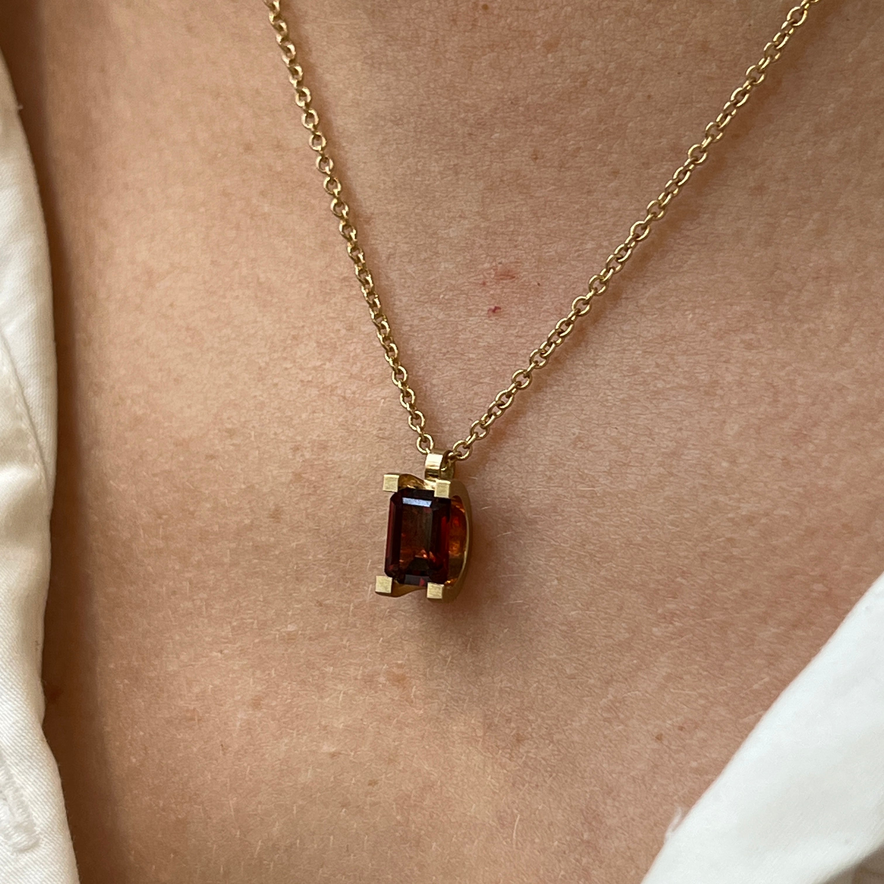 Curve Claw Garnet Pendant