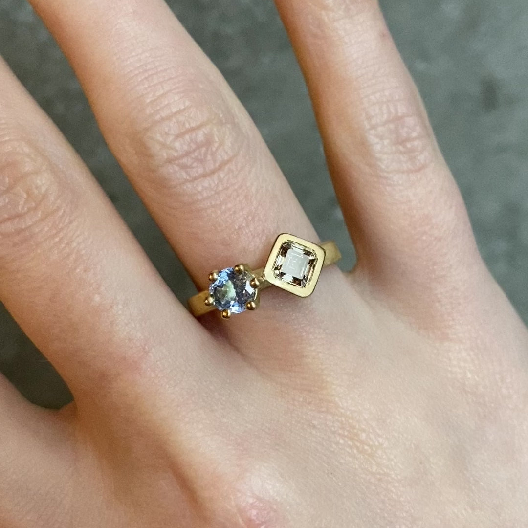 Champagne diamond and blue sapphire side by side blue in yellow gold on a textures band 